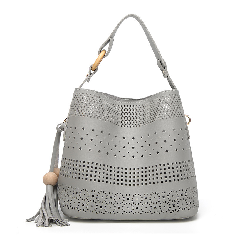 HD0827 - Vente en gros d'un sac à bandoulière en cuir creux pour femmes, Shopping