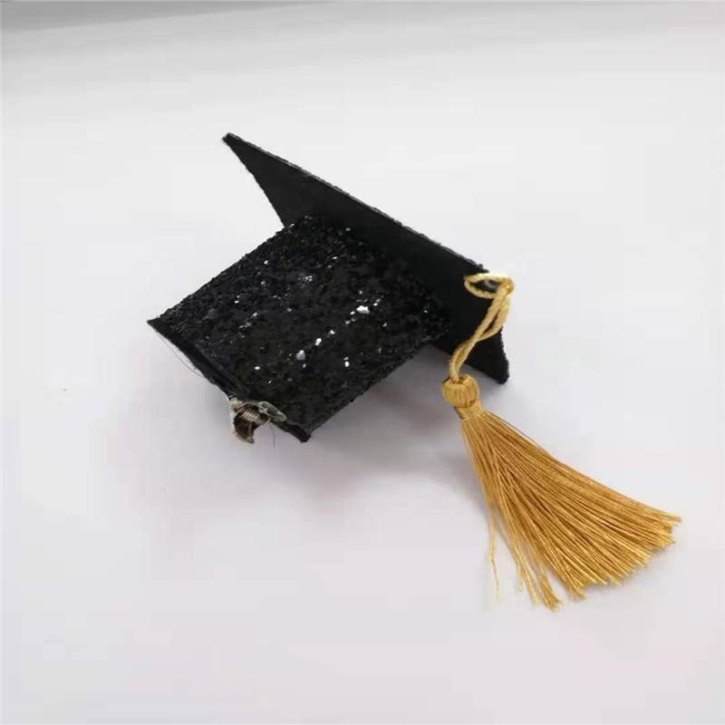 Chapeau de graduation noir et blanc avec gland glitter pour la fête
