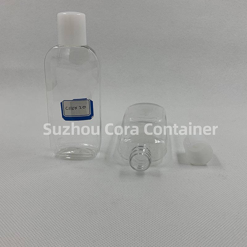 Bouteille de maquillage en plastique avec couvercle rotatif