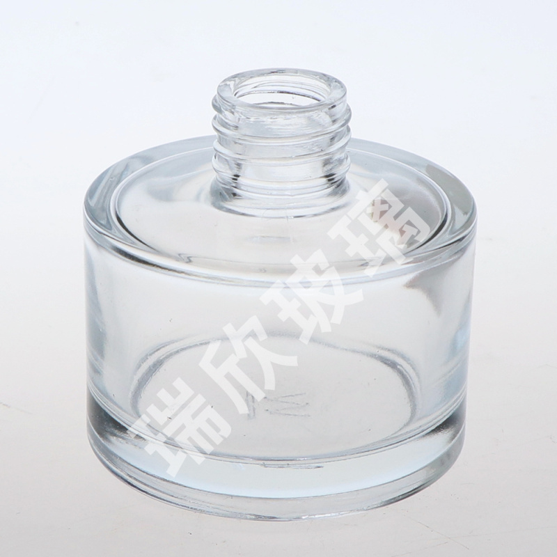 Diffuseur de roseaux de bouteille en verre de type rond de 100 ml avec capuchon à rouleau
