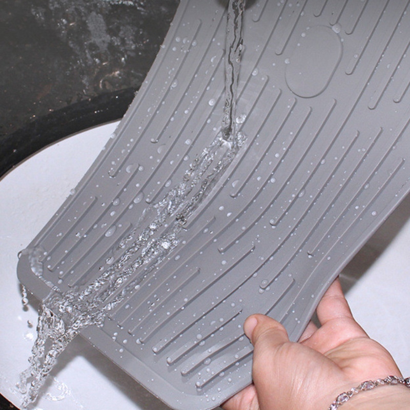 Bouton rectangulaire pour maintenir le tampon de drainage