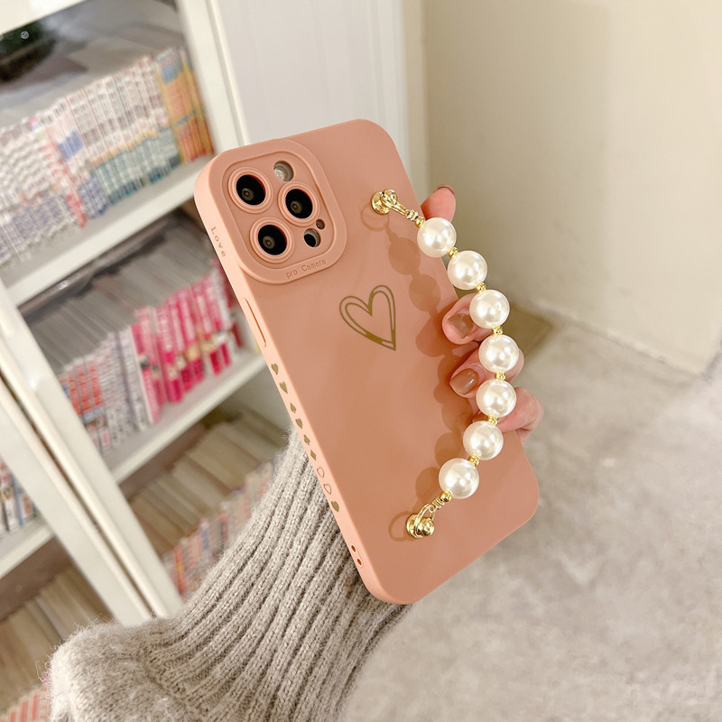 Lenouveau produit est applicable à l'Apple iPhone14Pro Pearl Bracelet Protective Case, et l'objectif est entièrement protégé et mis àniveau